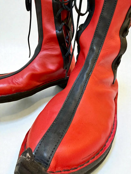 Vibrant red medieval leather boots with black laces and full-grain texture, ideal for LARP or Renaissance faire