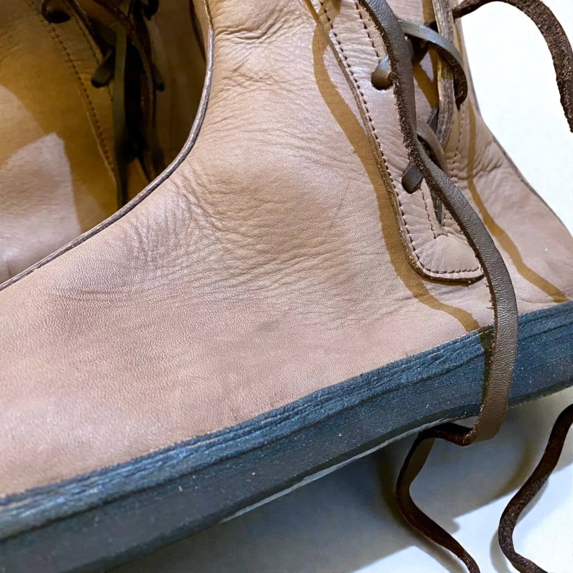 Tan full-grain leather boot with wrap laces and sturdy sole, ideal for medieval or Viking reenactment footwear.