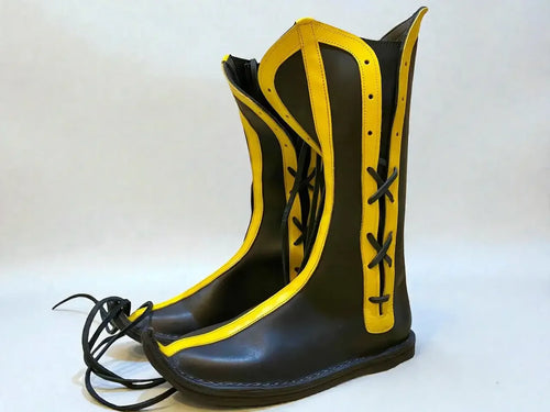 Black and yellow handmade medieval leather boots with wrap laces and full-grain leather texture, ideal for LARP or Renaissance faire.
