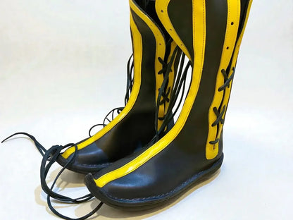 Black and gold handmade medieval leather boots with wrap laces and full-grain leather texture, ideal for LARP or Renaissance faire.