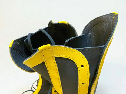 Black and yellow handmade leather boots with wrap laces and detailed stitching, ideal for LARP or Renaissance faire
