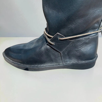Black handmade medieval leather boot with wrap laces and full-grain texture, ideal for LARP or SCA reenactment.