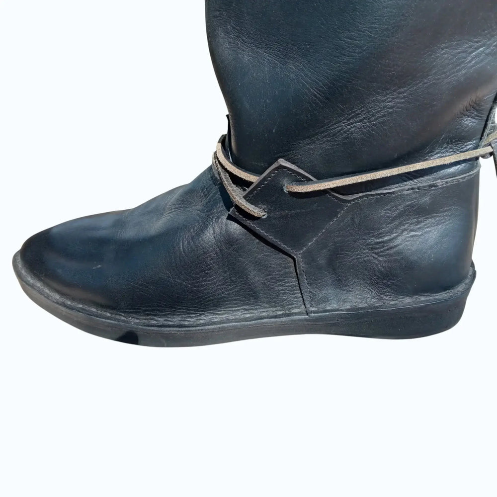 Black handmade medieval leather boot with wrap laces and full-grain texture, ideal for LARP or SCA reenactment.