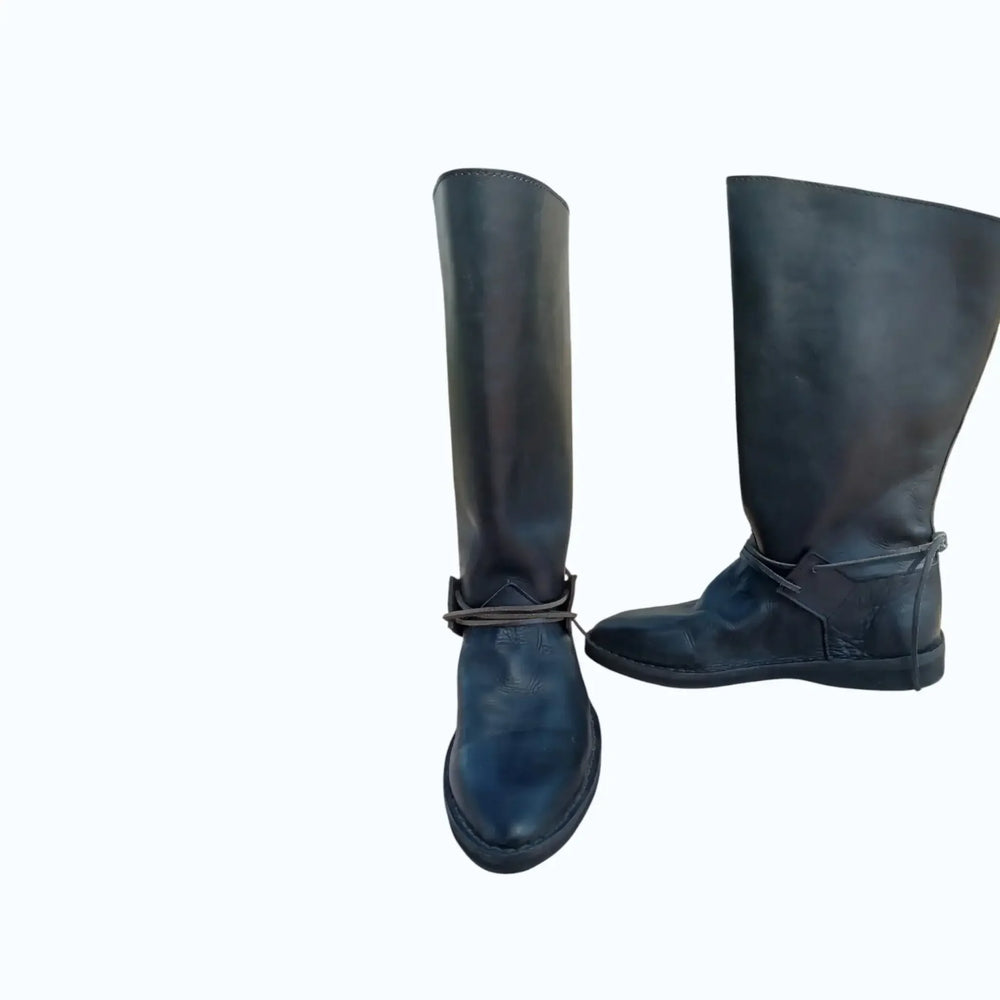 Handmade black medieval leather boots with wrap laces and full-grain texture, ideal for LARP or SCA reenactment.